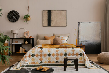 Interior design of bedroom interior with mock up poster frame, bed, orange bedding, wooden stool,...