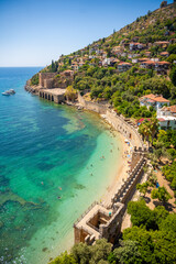 Ancient shipyard or Tersane near of Kizil Kule tower and beautiful beach and calm turquoise sea...
