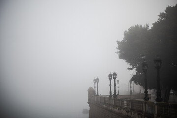walk in front of the bay of cadiz on a foggy day