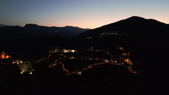Enchanting Aerial view of Savoca's Medieval Cathedral at Night | Sicilian Mountain Village, Stunning Architecture and Nighttime Beauty