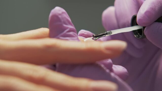  Close up video of master making nails in salon.