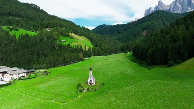 Church of St. Johann with The Dolomites mountains in the background in Val Di Funes valley, Trentino Alto Adige region, Italy, Europe.