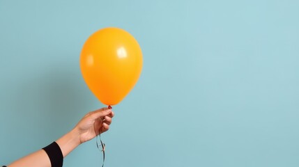 Hand holding baloon