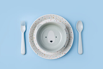 Cute children's plates and dishes shape of a bear. Creative serving for baby. Concept of kids menu,...