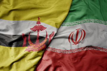 big waving realistic national colorful flag of brunei and national flag of iran .