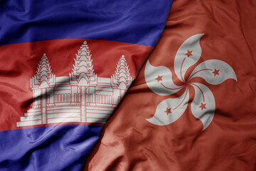 big waving realistic national colorful flag of cambodia and national flag of hong kong .