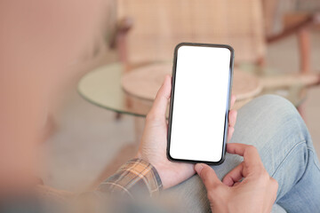 cell phone blank white screen mockup.hand holding texting using mobile on desk at office.background empty space for advertise.work people contact marketing business,technology