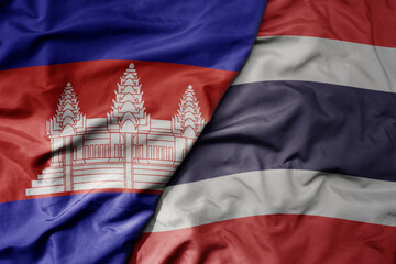 big waving realistic national colorful flag of cambodia and national flag of thailand .
