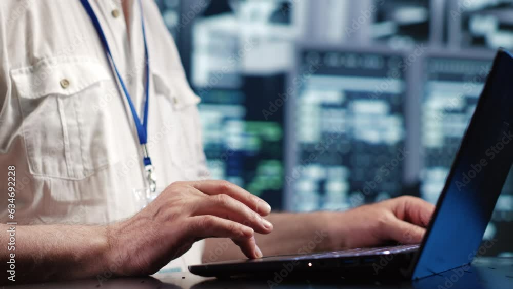 Poster certified it admin expertly managing data while navigating in industrial server room. trained comput