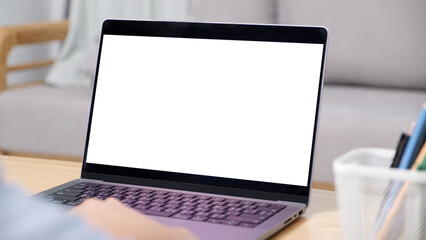 Man hand using laptop computer with blank screen for mock up template background