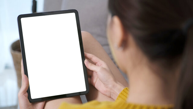 Woman hand using digital tablet with blank screen for mock up, template