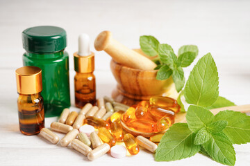 Alternative medicine herbal organic capsule with vitamin E omega 3 fish oil, mineral, drug with...