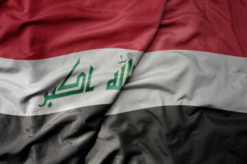big waving realistic national colorful flag of iraq and national flag of yemen .