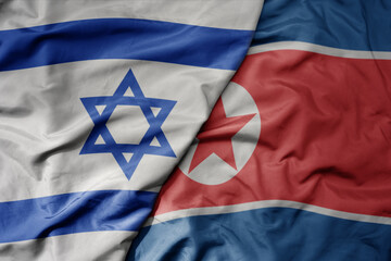 big waving realistic national colorful flag of israel and national flag of north korea .