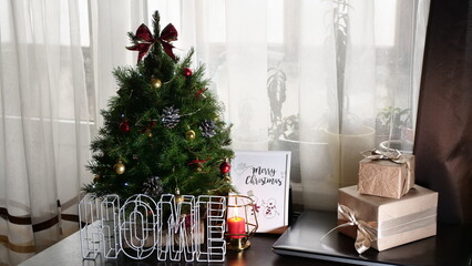 New Year's holiday, Christmas canoon at home with a Christmas tree, candles, postcards, handouts, gifts, present, boxes
