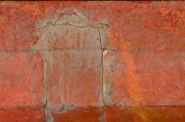 Red rusted weathered metal surface