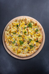 Italian cuisine. Delicious pizza on a dark background