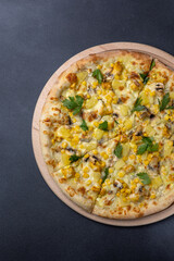 Italian cuisine. Delicious pizza on a dark background