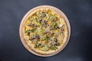 Italian cuisine. Delicious pizza on a dark background