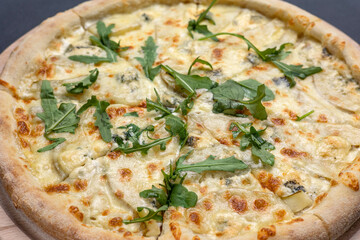 Italian cuisine. Delicious pizza on a dark background