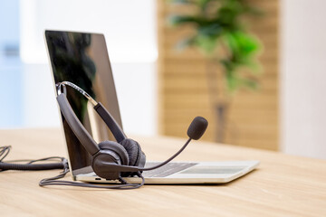Close up soft focus head phone Communication support, call center and customer service help desk.
