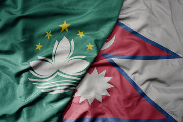 big waving realistic national colorful flag of Macau and national flag of nepal .