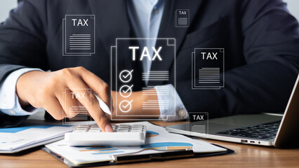 Tax and Vat concept. Government, state taxes concept.  Businesman using laptop to complete...