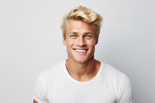 A close-up portrait photograph of an attractive blonde Scandinavian man grinning, showcasing his immaculate teeth, intended for a dental advertisement. Trendy hairstyle. Generative AI