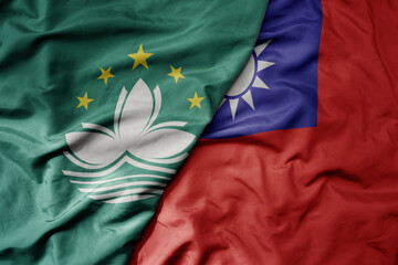 big waving realistic national colorful flag of Macau and national flag of taiwan .