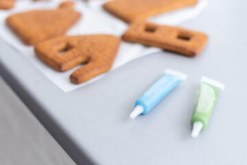 Icing of Christmas bakery. honey gingerbread cookies, ready to decorate.