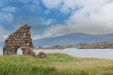 Scotland's countryside landscape with historic ruins and oxen-