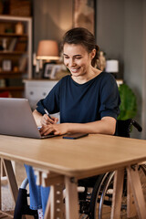 Fototapeta premium Working at home office, taking notes.