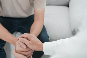 psychiatrist hold hand support each while discussing family issues. doctor encourages and empathy woman suffers depression. psychological, save divorce, Hand in hand together, trust, care.