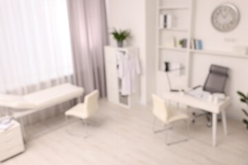 Blurred view of medical office interior with doctor's workplace