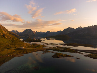 Panoramic view of Lofoten at sunset, high peaks, fjords, Fredvang bridges.