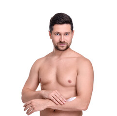 Fototapeta premium Handsome man applying sun protection cream onto arm against white background