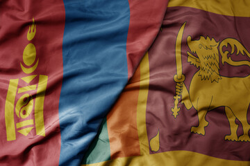 big waving realistic national colorful flag of mongolia and national flag of sri lanka .