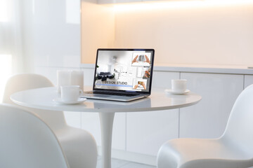 laptop with design studio online, App
