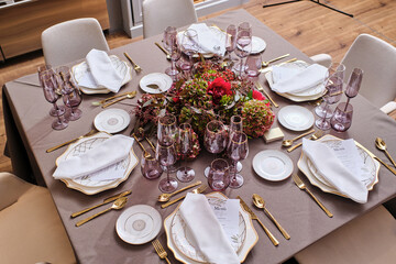 Banquet table with plates and glassware