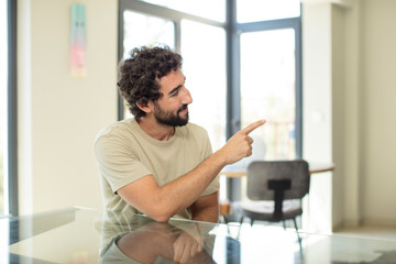 Obraz premium young bearded man with a copy space on a table