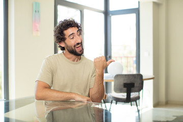 Fototapeta premium young bearded man with a copy space on a table