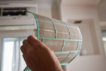 Dirty air conditioner filter need cleaning. Air conditioner service, repair and clean equipment.