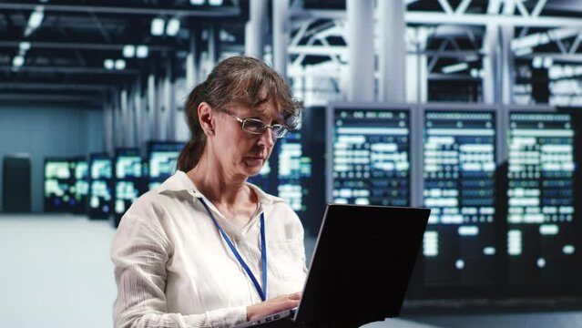 Experienced manager looking around innovative supercomputer headquarters, preparing to start comission on malfunctioning high tech electronics rigs in order to ensure faultless operations