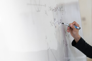 asian teacher write on white board. Woman writing on white board wall. Idea creative education...