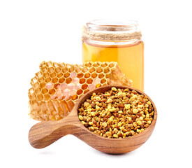 Honeycomb  isolated on white background closeup. Liquid honey. Bee pollen in the  spoon.