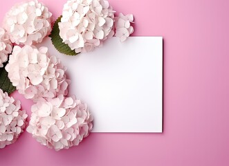 Obraz premium Beautiful pink hydrangea flowers, white wooden photo frames on pink background top view flat lay copy space. Flower card.