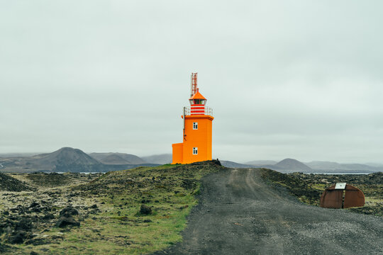 Pretty orange Hopsnes Lighthouse near Grindavik, Iceland on the Reykjanes Peninsula