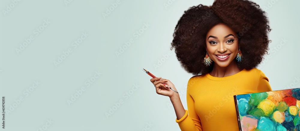 Poster excited african woman holding painter palette pointing aside with open palms showcasing copy space f