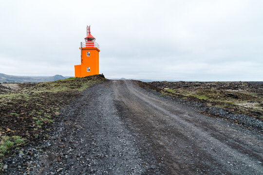 Pretty orange Hopsnes Lighthouse near Grindavik, Iceland on the Reykjanes Peninsula