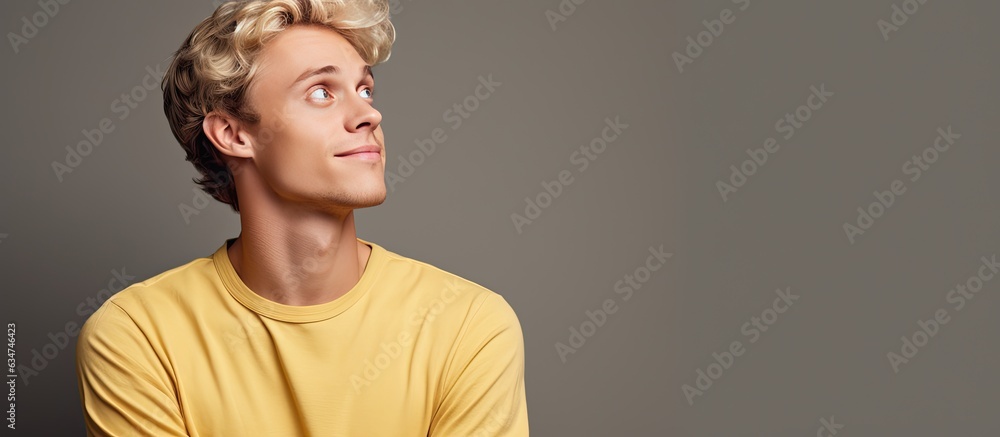Poster blond man daydreaming and looking towards empty space